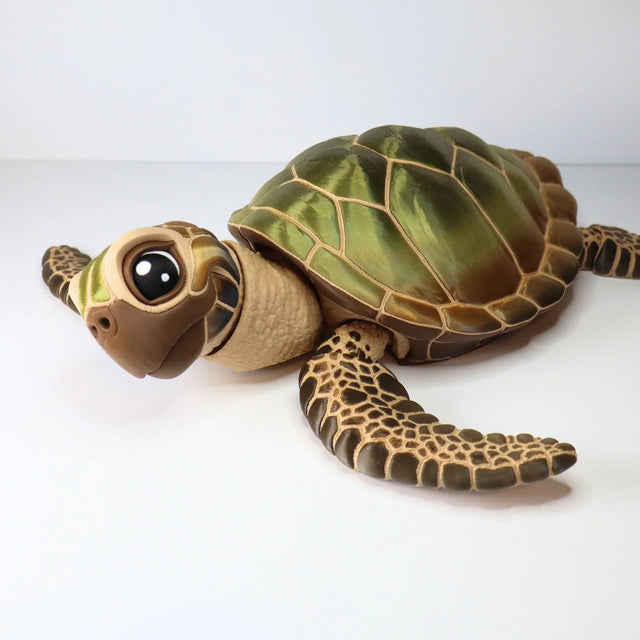 3D printed sensory sea turtle toy with green shell and textured flippers on white background