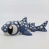 Blue and white 3D printed shark sensory toy with spots, jointed body, and large eyes on white background.