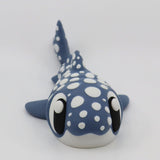 Blue and white 3D printed whale shark sensory toy with large eyes on a white background