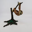3D printed sloth sensory toy hanging from a tree branch with movable joints.