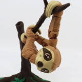 3D printed articulated sloth sensory toy hanging from tree branch, educational fidget