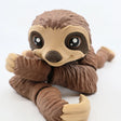 Cute 3D printed flexible sloth sensory toy with articulated limbs and large eyes on white background