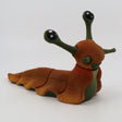 3D printed orange and green slug sensory toy for children on white background