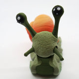 3D printed sensory snail toy with green body and orange shell on white background