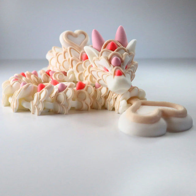 3D printed sensory dragon toy with pastel heart details, ideal for sensory play