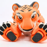 3D printed sensory tiger toy, bright orange with black stripes, on white background