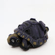 3D printed sensory tortoise toy with articulated shell and purple, tan, and black details