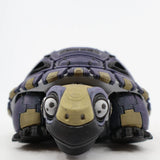 3D printed sensory tortoise toy with purple and beige segments, front view against white background