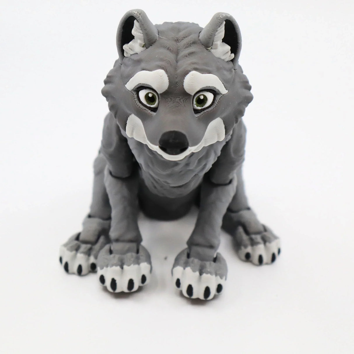 3D printed gray wolf sensory toy with articulated joints on a white background