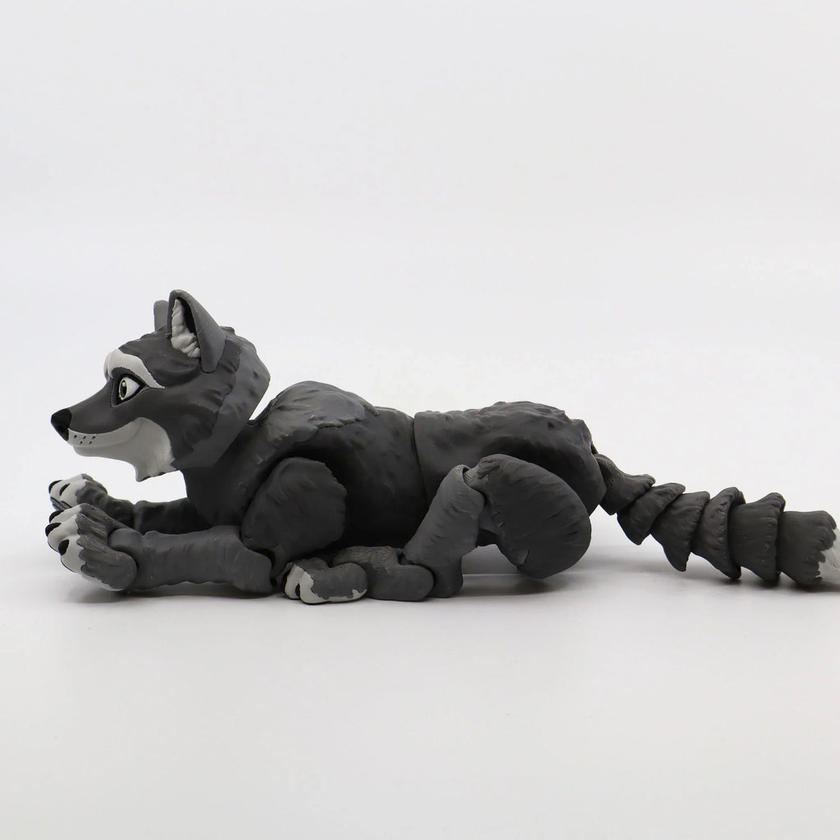 Gray 3D printed sensory wolf toy with articulated limbs on white background