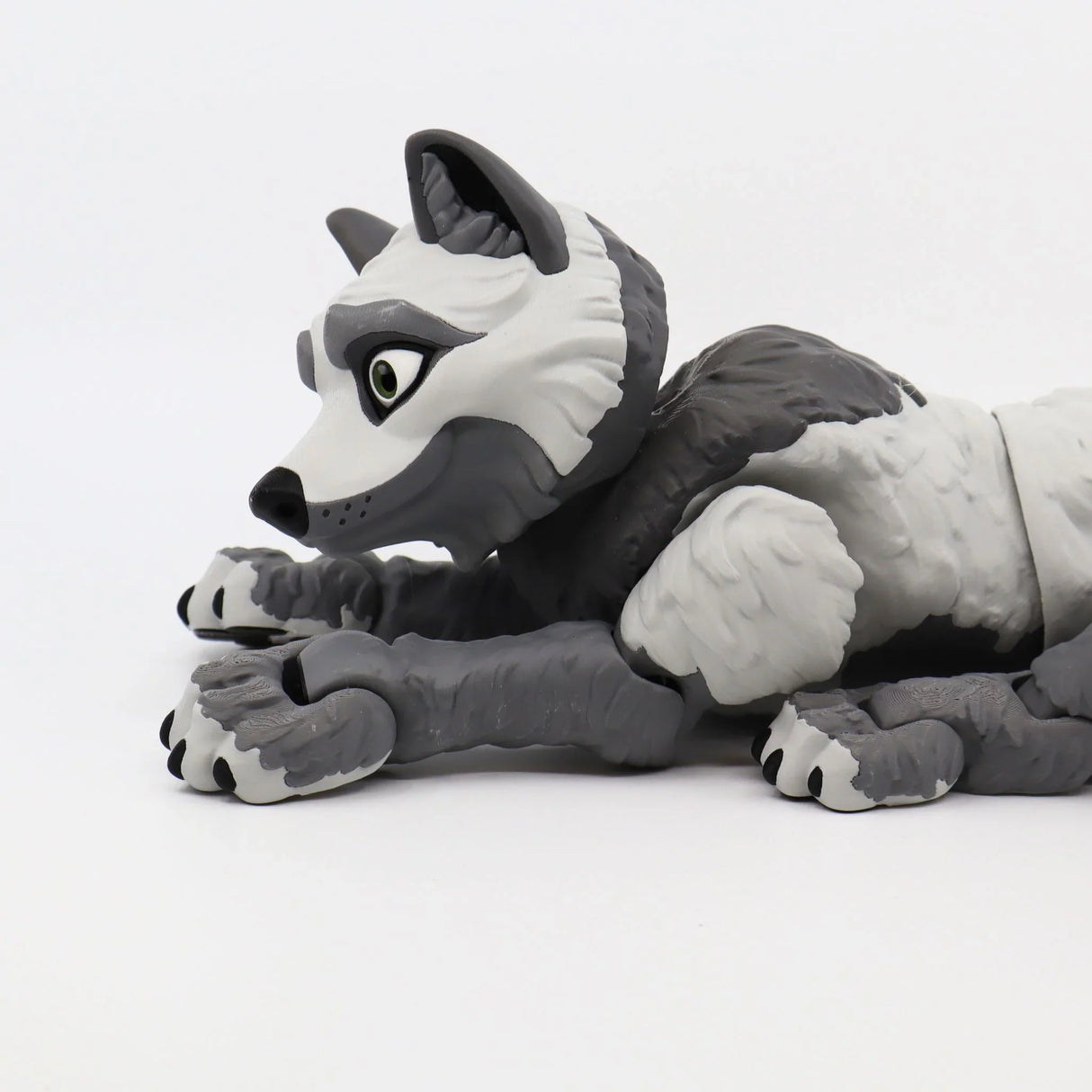 Gray and white 3D printed wolf sensory toy with movable joints on a white background