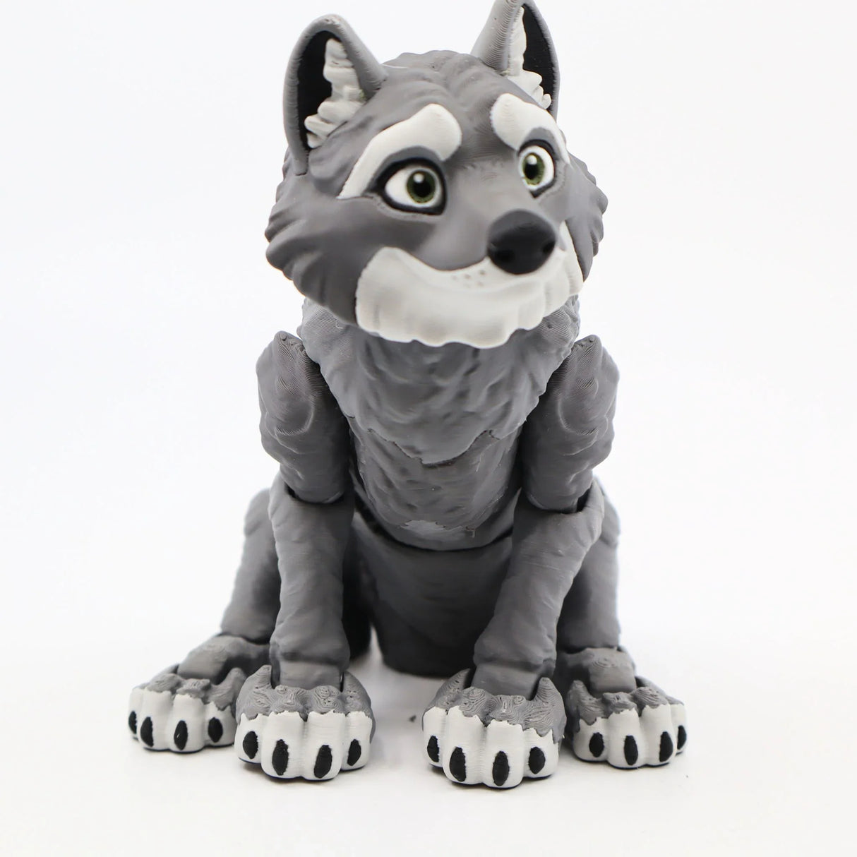 Cute gray 3D printed wolf sensory toy with big eyes and textured fur, sitting upright