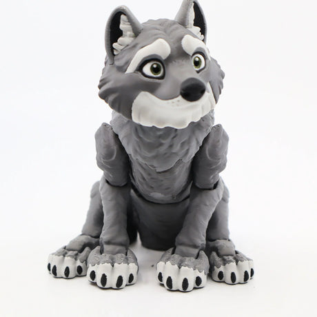 Cute gray 3D printed wolf sensory toy with big eyes and textured fur, sitting upright