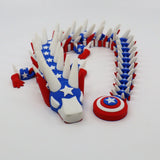 3D printed patriotic flexi dragon with stars, stripes, and shield for sensory play