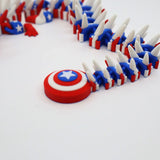 3D printed Captain America shield fidget toy with red, white, blue segments and tactile spikes for sensory play