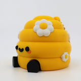 Yellow 3D printed fidget toy with daisy flowers and cute face for sensory play