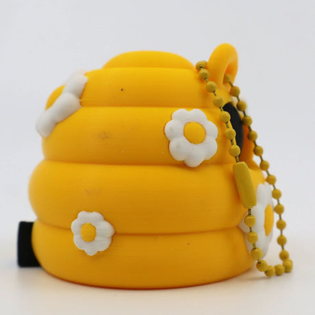 Yellow 3D printed fidget toy with daisy flowers and bead chain, sensory tool for kids