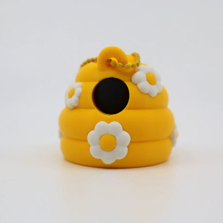 Yellow 3D printed fidget toy with white daisies and keychain, sensory-friendly design for kids