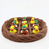 Colorful 3D printed duck sensory toys in a brown nest, perfect for fidgeting and sorting activities.