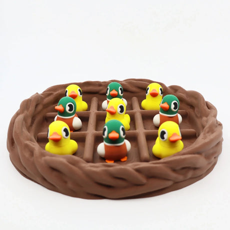 Colorful 3D printed duck sensory toys in a brown nest, perfect for fidgeting and sorting activities.