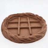 3D printed chocolate bar fidget toy with textured squares and braided edge for sensory play