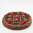 3D printed cardinal and gray bird sensory toys in a nest, perfect for fidgeting and sorting activities