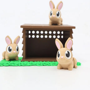 Cute 3D printed brown bunny toys with a play hutch on green grass, sensory toy set