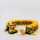 3D printed yellow school bus fidget toy with flexible segments and stop sign, sensory-friendly design