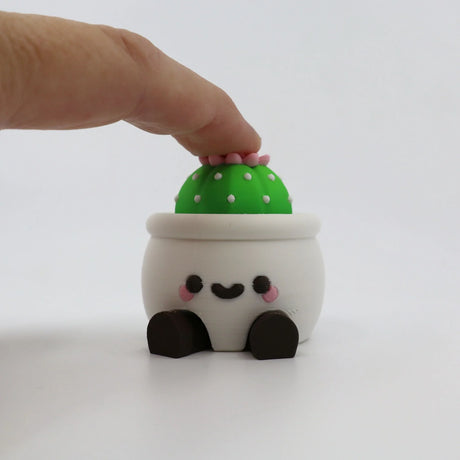 Adorable 3D printed cactus fidget toy with smiling pot, perfect for sensory play and stress relief