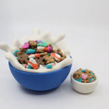Colorful 3D printed sensory cereal toys in playful bowls on white background