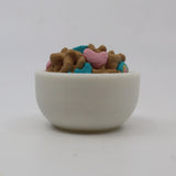3D printed sensory toy bowl filled with colorful cereal-shaped pieces