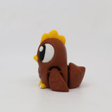 Brown 3D printed sensory chicken toy with yellow details on a white background