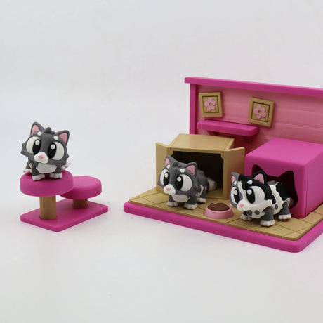 3D printed cat sensory toy playset with three cartoon cats, pink platform, and cat house