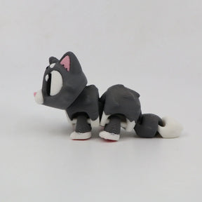 3D printed gray and white cat sensory toy with flexible joints on white background