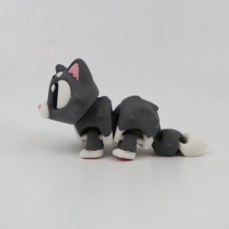 3D printed gray and white cat sensory toy with flexible joints on white background