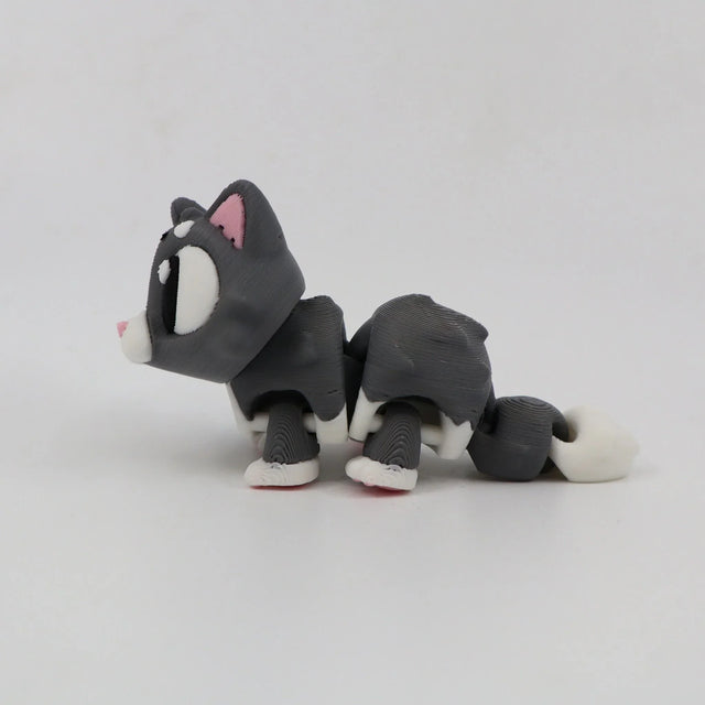 3D printed gray and white cat sensory toy with flexible joints on white background