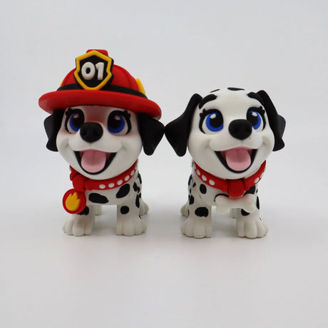 3D printed Dalmatian puppy toys, one in firefighter hat, for sensory play and learning