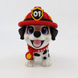 3D printed fire pup fidget toy with red helmet, blue eyes, and flame badge for sensory play