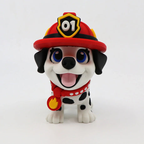 3D printed fire pup fidget toy with red helmet, blue eyes, and flame badge for sensory play