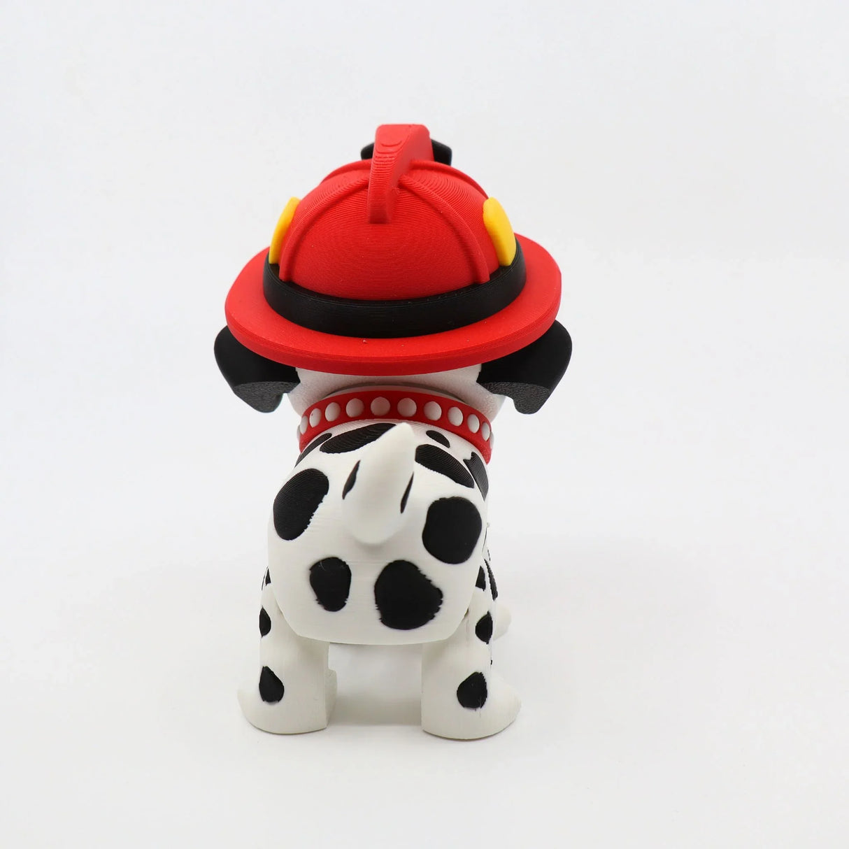3D printed Dalmatian fidget toy with red firefighter helmet, sensory-friendly design for kids