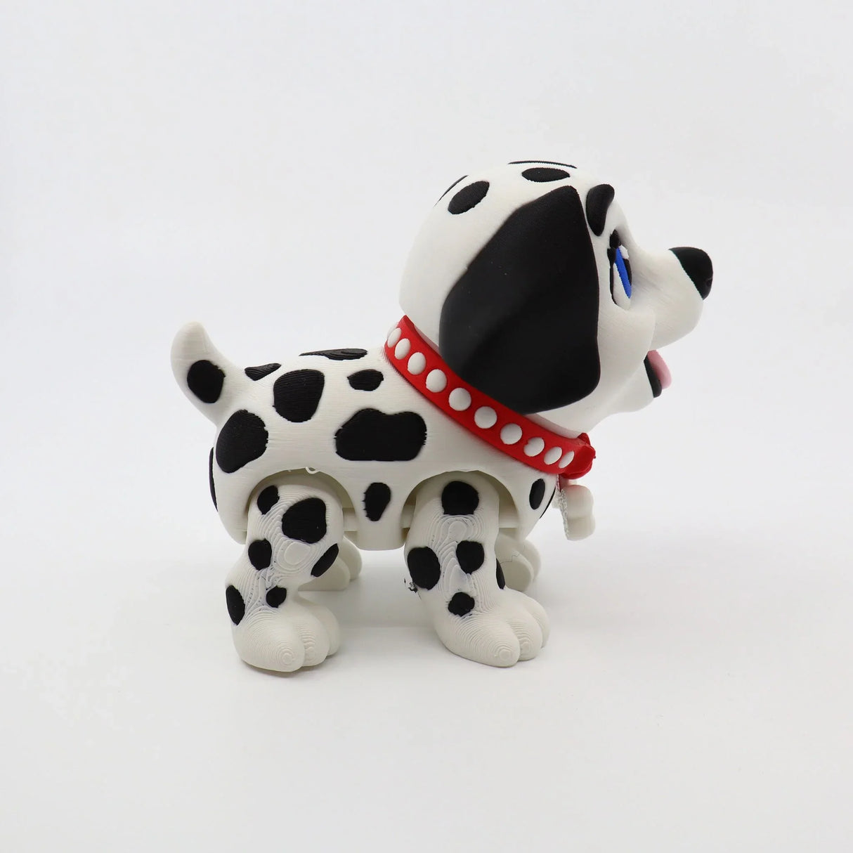 3D printed Dalmatian fidget toy with red collar, sensory-friendly design for kids