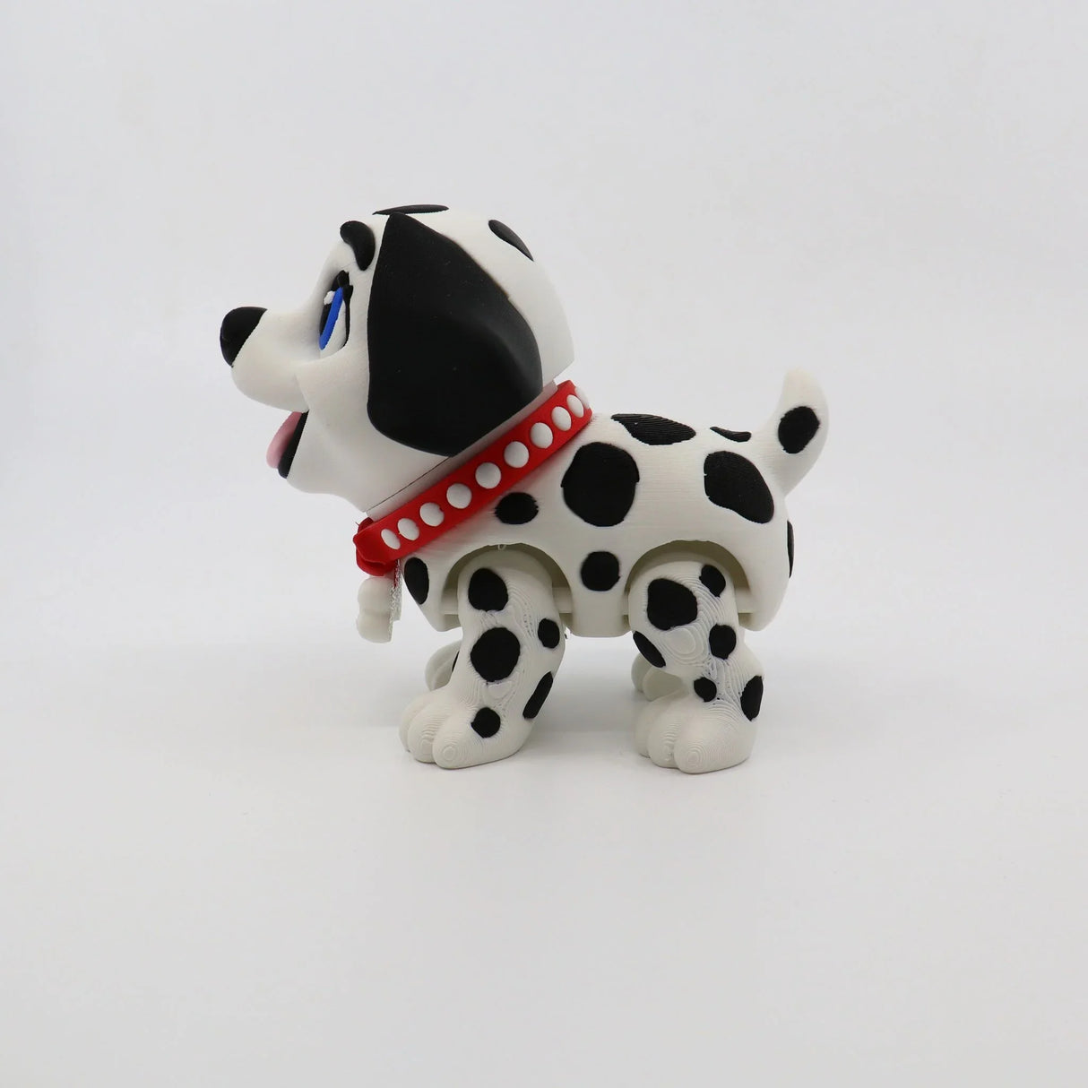 3D printed Dalmatian fidget toy with red collar, sensory-friendly design for kids