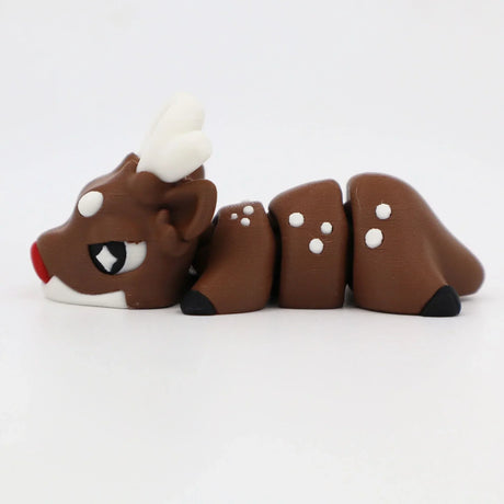 3D printed flexible brown reindeer sensory toy with white antlers and red nose on white background
