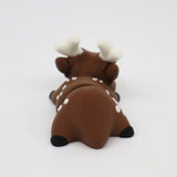 Brown 3D printed fawn sensory toy with white spots and antlers on a white background
