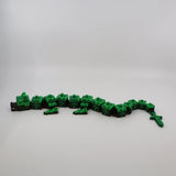 Pixelated green and brown 3D printed flexi dragon toy for sensory play and fidgeting