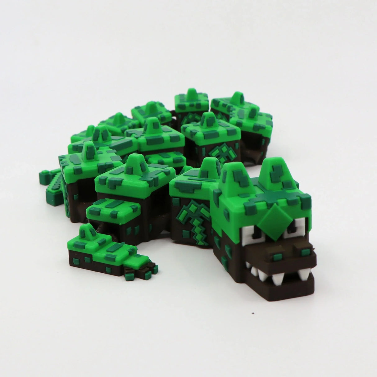 3D printed pixelated green and brown flexi alligator fidget toy for sensory play