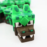 3D printed pixel dinosaur fidget toy for sensory play, green and brown blocky design