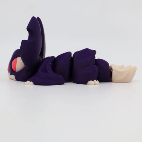 Purple 3D printed sensory toy caterpillar with segmented body and large eyes on white background