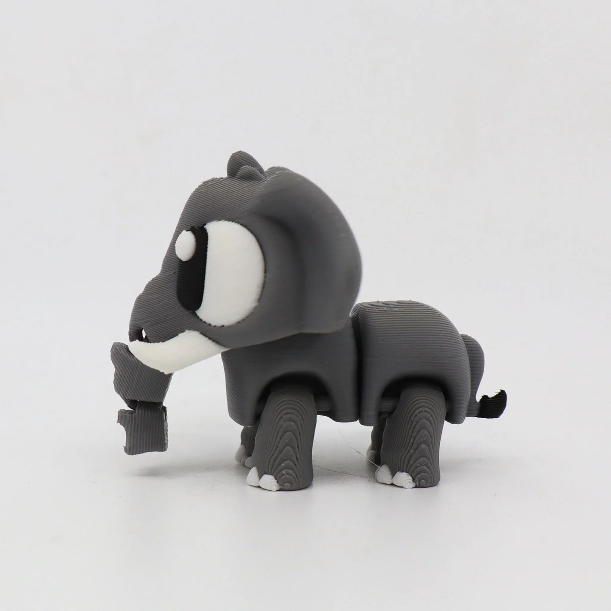 Gray 3D printed elephant sensory toy with white accents on a plain white background