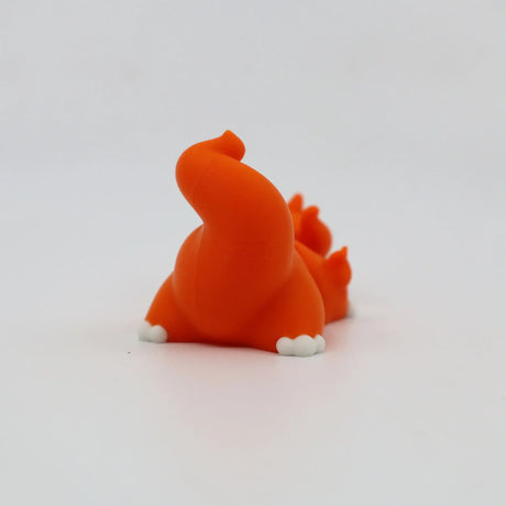 Orange 3D printed flexi dinosaur toy for sensory play and fidgeting